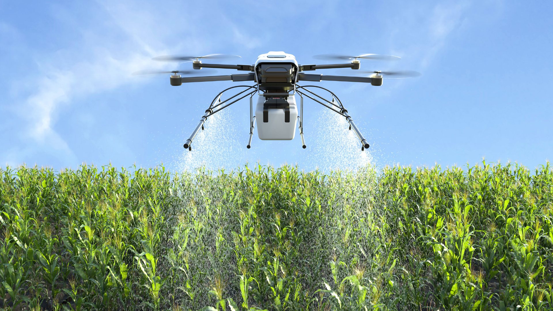 Agricultural drone flying above a green crop field